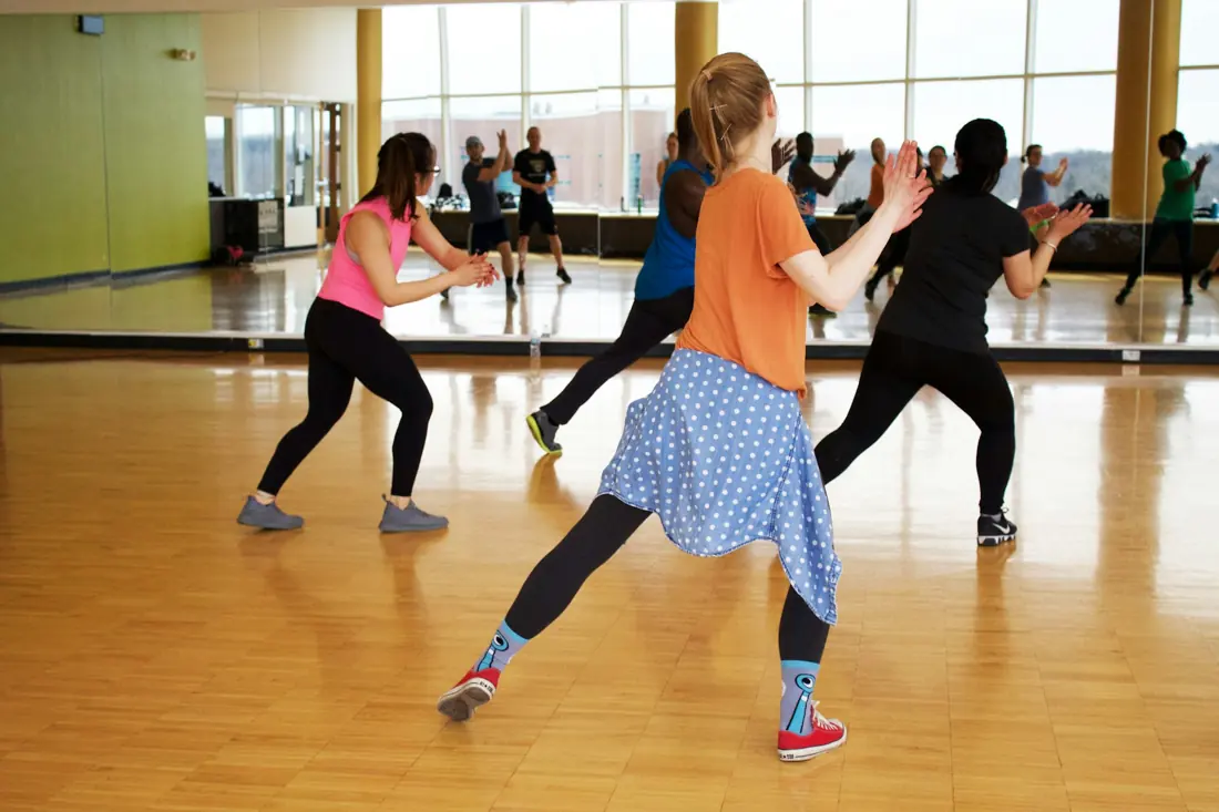 A dance fitness class in a studio