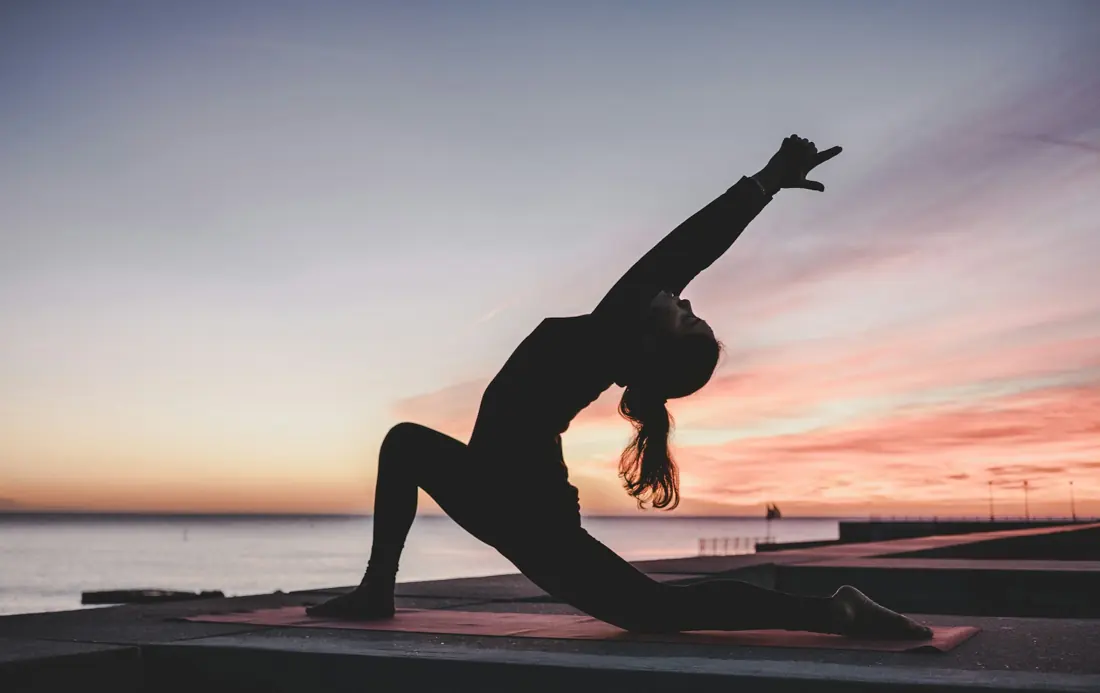 Woman stretching on a yoga mat